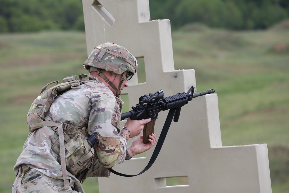 Virginia Army National Guard Soldier changes magazine during Region II Best Warrior Competition