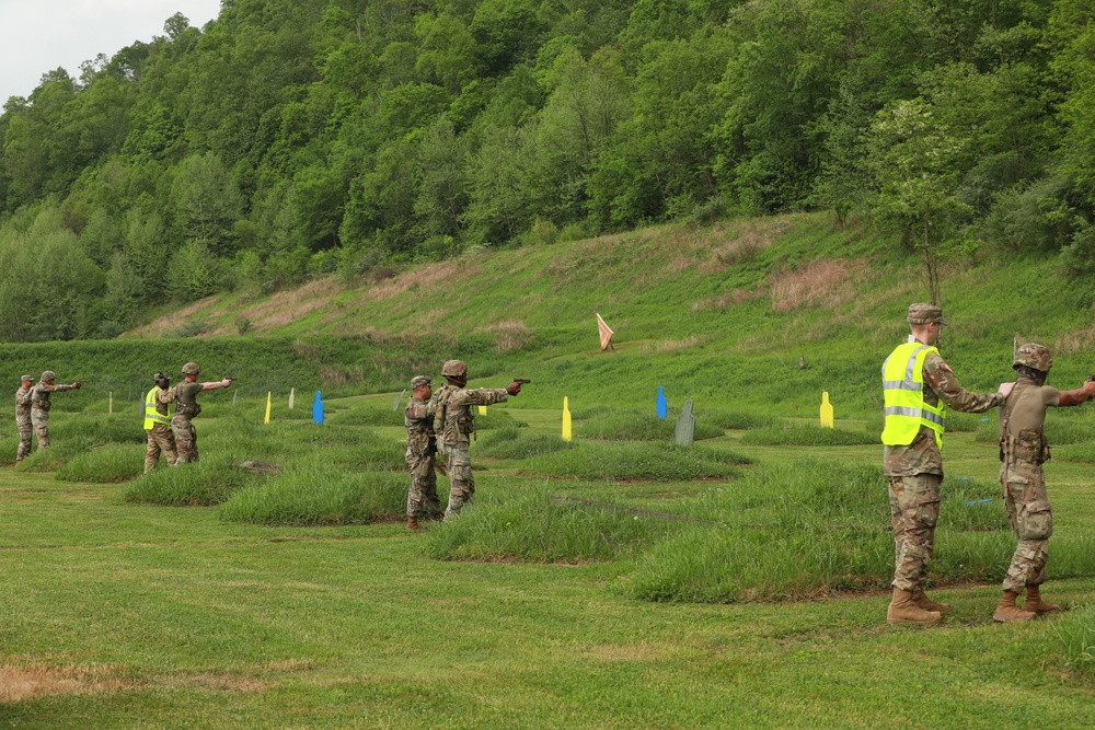 Competitors Fire Pistols as part of Region II Best Warrior Competition