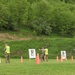 Competitors Fire Pistols during Region II Best Warrior Competition