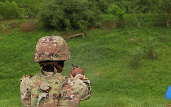 Competitor Fires Pistol during Region II Best Warrior Competition