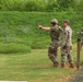 Competitors Fire Pistols during Combat Pistol Qualification Course