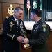 Colonel David J. Haskell presents the Distinguished Honor Graduate award to a student