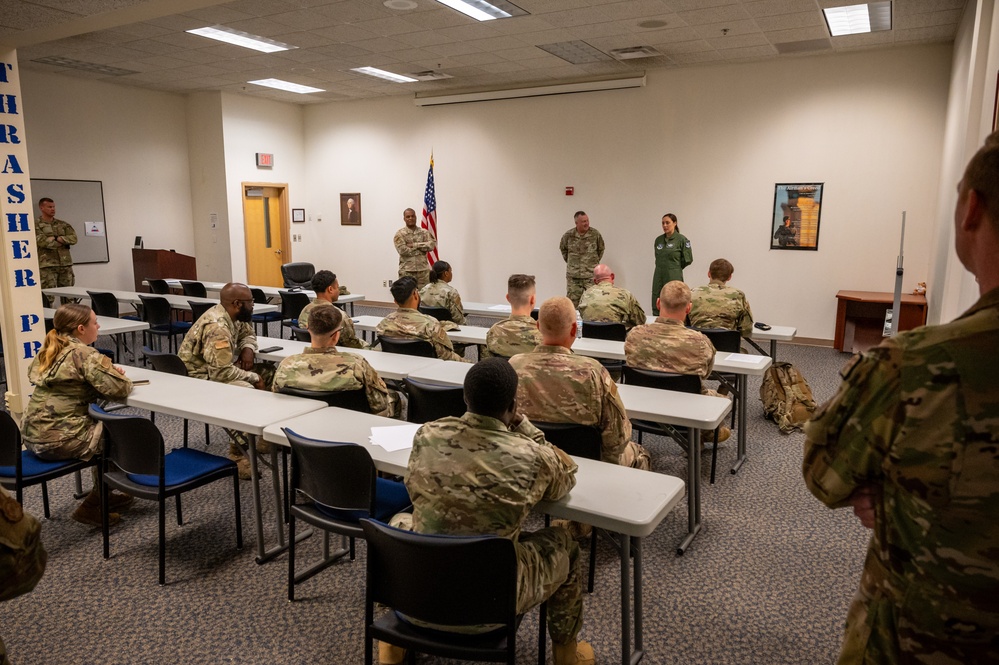 Photo of 116th Security Forces Squadron Airmen being greeted by wing leadership after deployment