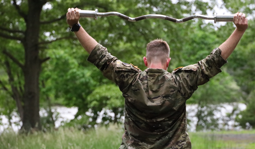 Maryland Army National Guard Soldier using an EZ Bar for a Static Hold during the Region II Best Warrior Competition