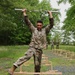 Maryland Army National Guard Soldier Steps Over Hurdles while Holding an EZ Bar During the Region II Best Warrior Competition