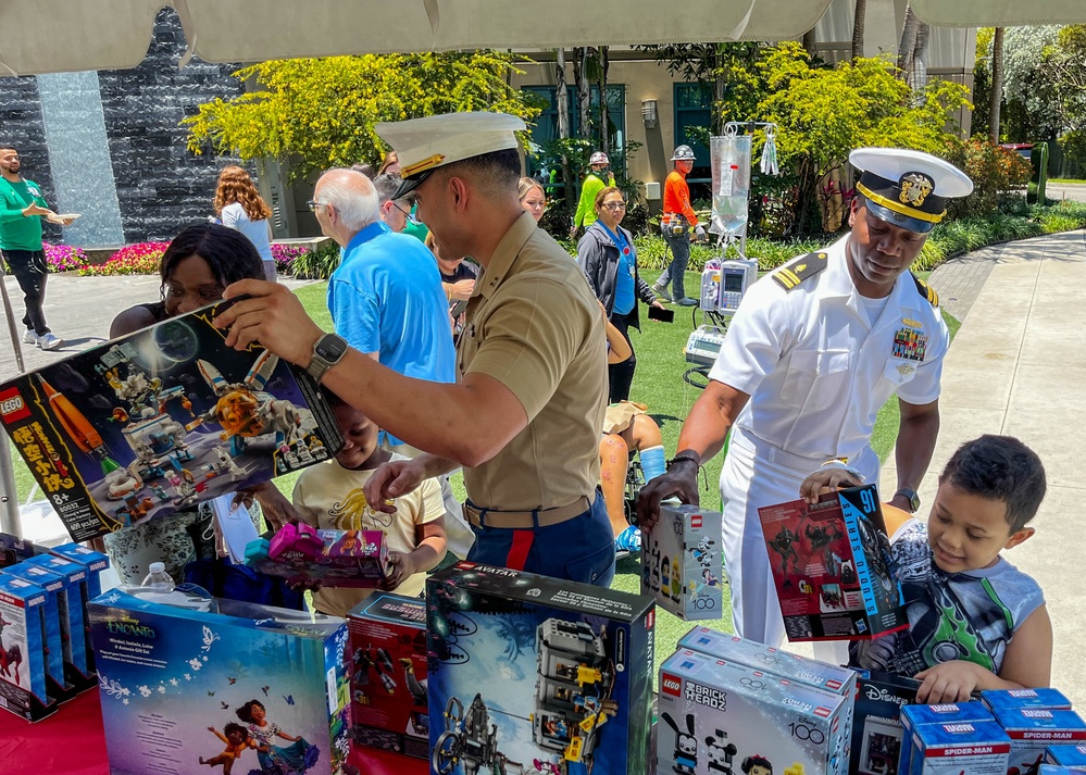 U.S. Marines and Sailors pass out toys during a community outreach event at Nicklaus Children’s Hospital as part of Fleet Week Miami on May 9, 2024.