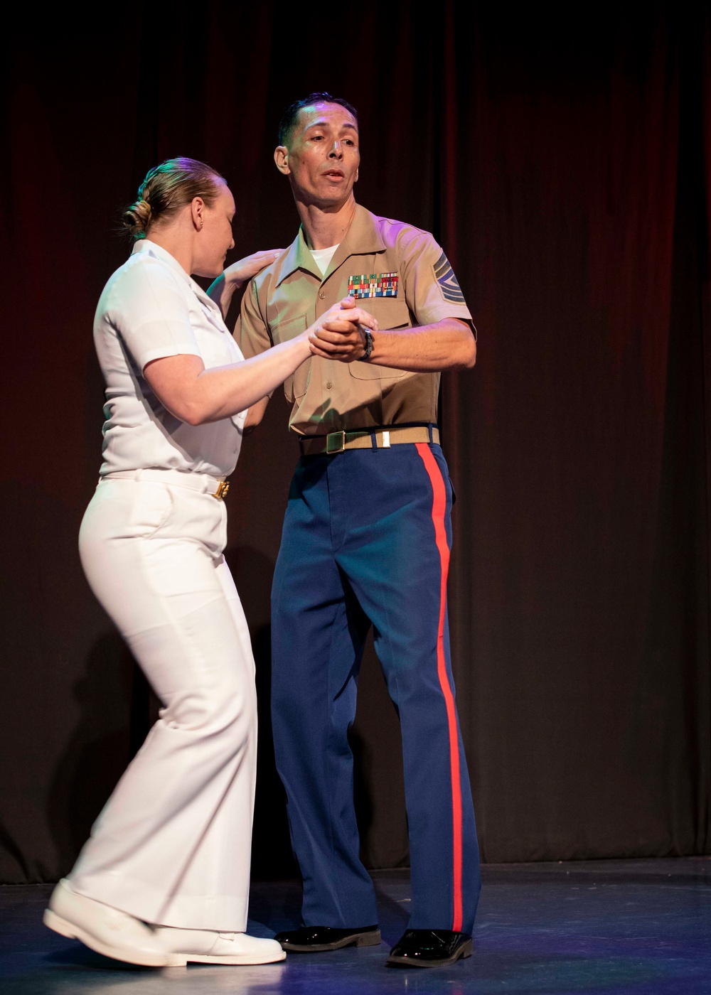 U.S. maritime service members participate in a salsa competition in Miami’s historic Tower Theater