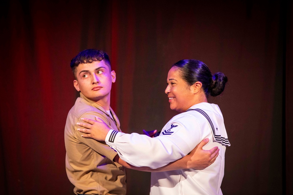 U.S. maritime service members participate in a salsa competition in Miami’s historic Tower Theater