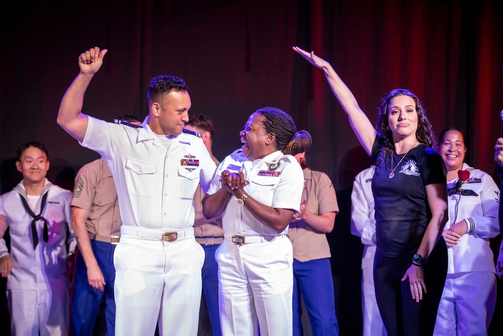 U.S. maritime service members participate in a salsa competition in Miami’s historic Tower Theater