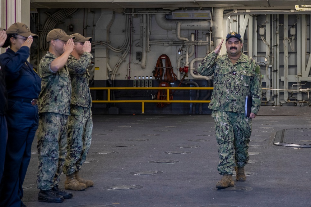 USS Tripoli's Crew Pipes ET2 Rodriguez Ashore