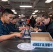 USS Ronald Reagan (CVN 76) Sailors play board games during Morale, Welfare, and Recreation event