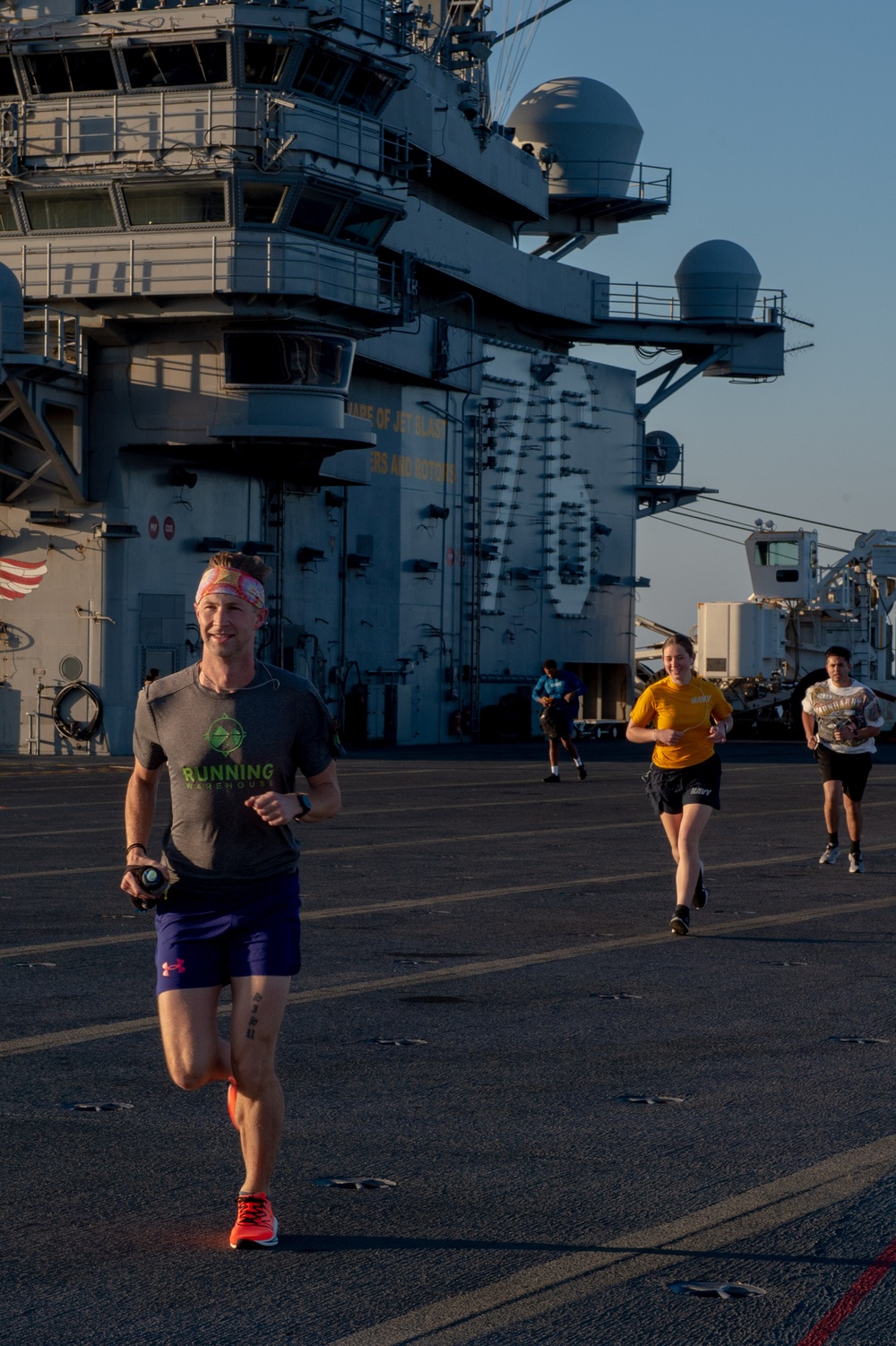 USS Ronald Reagan (CVN 76) Sailors participate in flight deck 5K run