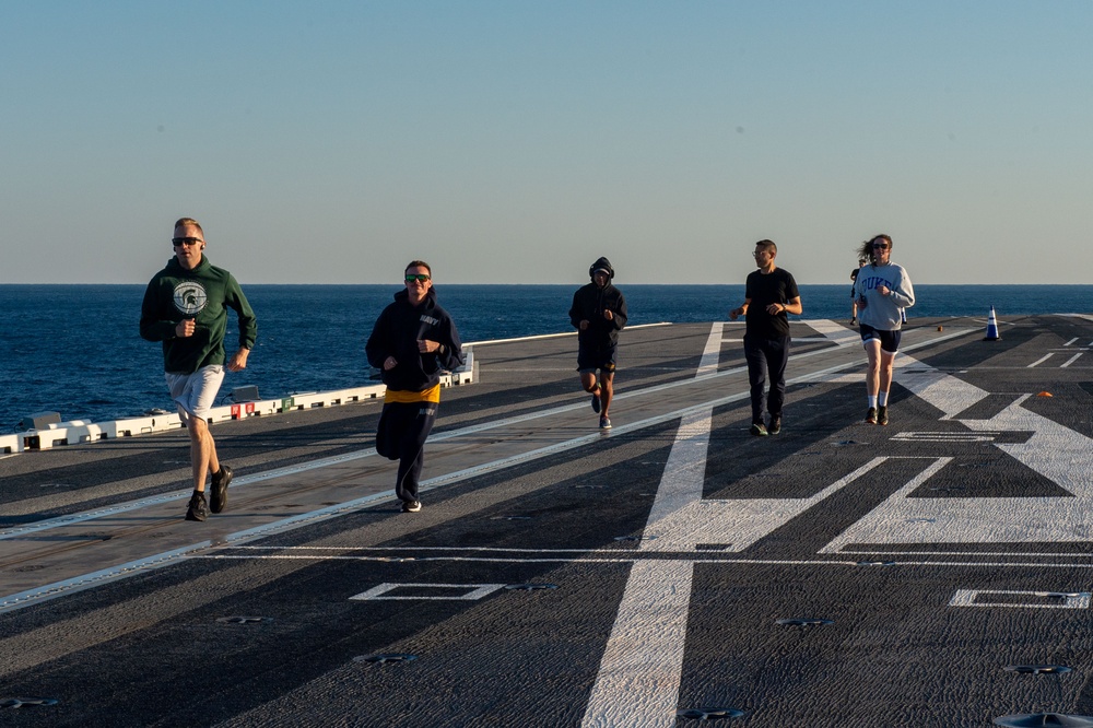 USS Ronald Reagan (CVN 76) Sailors participate in flight deck 5K run
