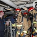 Sailors aboard the USS Howard conduct a damage control training team drill in the South China Sea