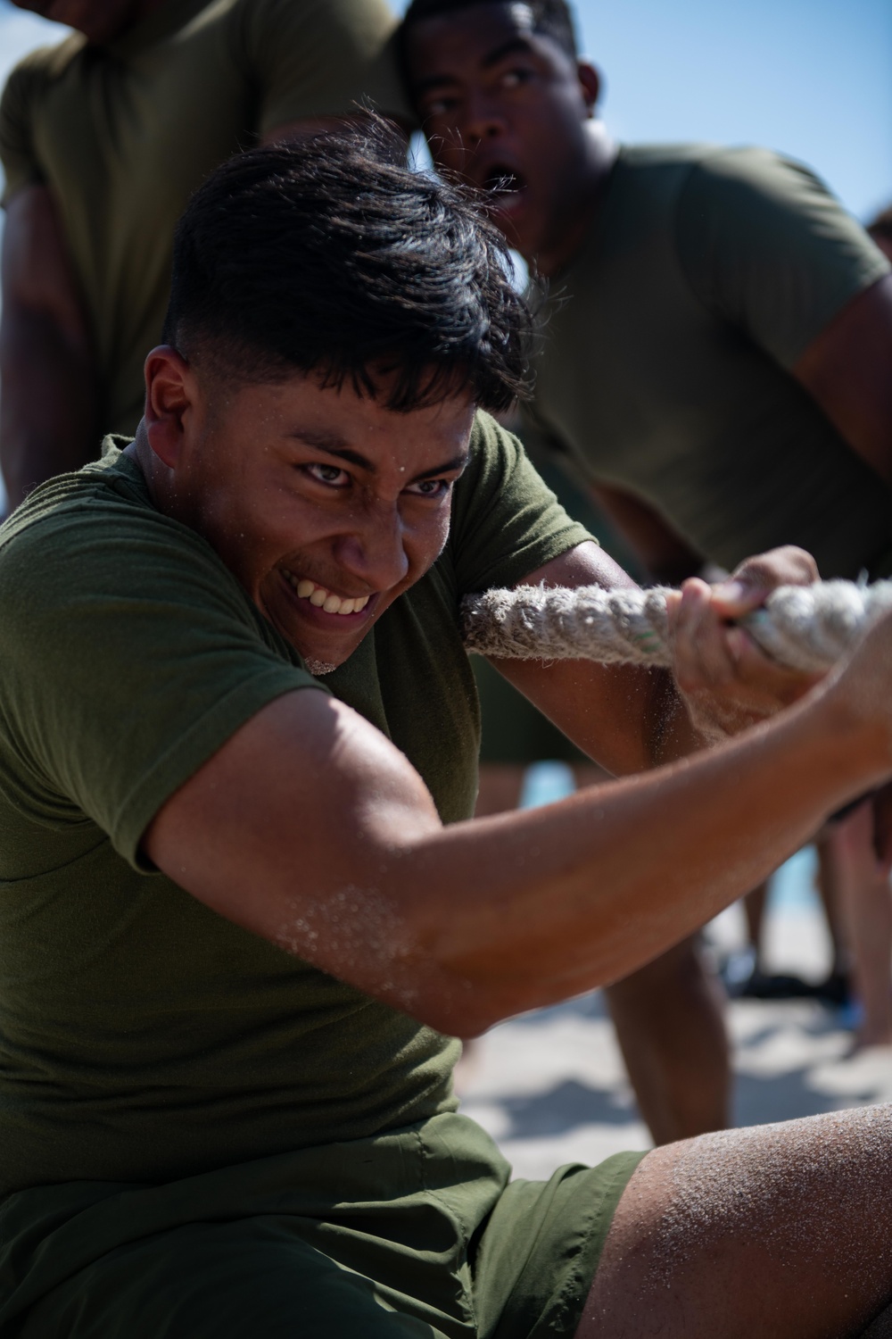 U.S. Marine competes in tug-of-war during the “Top Gun” Beach Olympics event in Miami Beach, Fla., during Fleet Week Miami, May 11, 2024.