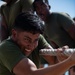 U.S. Marine competes in tug-of-war during the “Top Gun” Beach Olympics event in Miami Beach, Fla., during Fleet Week Miami, May 11, 2024.