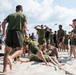 U.S. Marines celebrate winning a game of tug-of-war during the “Top Gun” Beach Olympics event in Miami Beach, Fla., during Fleet Week Miami, May 11, 2024.