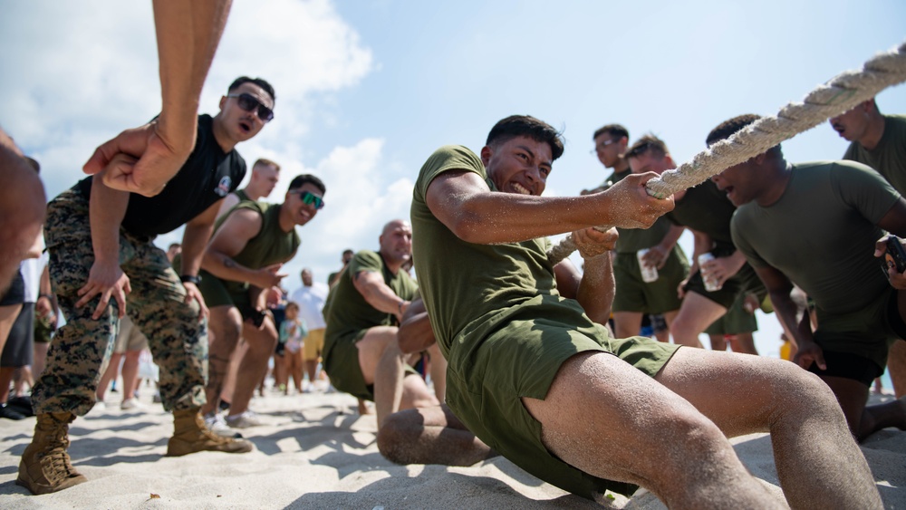 U.S. Marines compete in tug-of-war during the “Top Gun” Beach Olympics event in Miami Beach, Fla., during Fleet Week Miami, May 11, 2024.