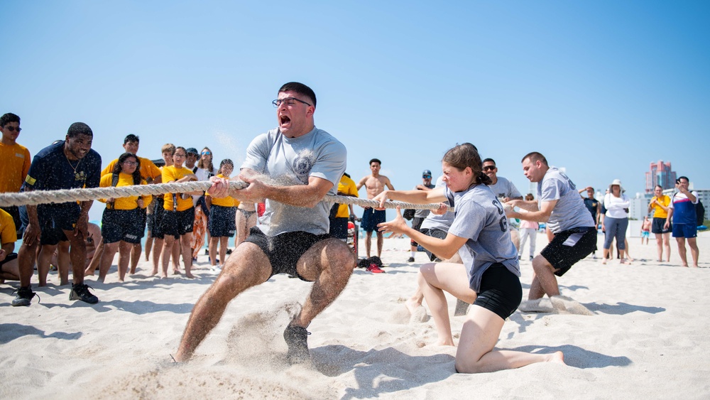 U.S. Coast Guard members compete in tug-of-war during the “Top Gun” Beach Olympics event in Miami Beach, Fla., during Fleet Week Miami, May 11, 2024.