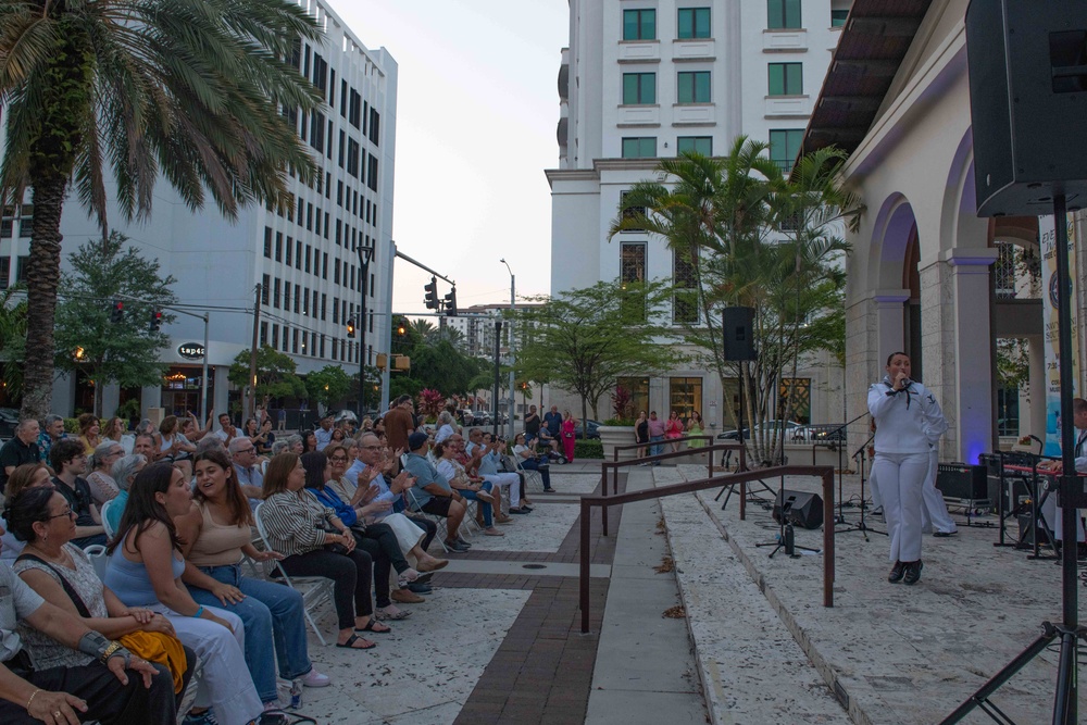 U.S. Navy Musician 3rd Class Bernadette Rocks, from Tannersville, N.J., assigned Navy Band Southeast, performs to a crowd during a public concert in Coral Gables, Fla., during Fleet Week Miami May 11, 2024.