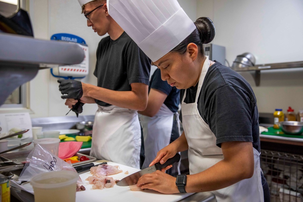 U.S. maritime servicemembers participate in a “Galley Wars” cooking competition at Miami-Dade College