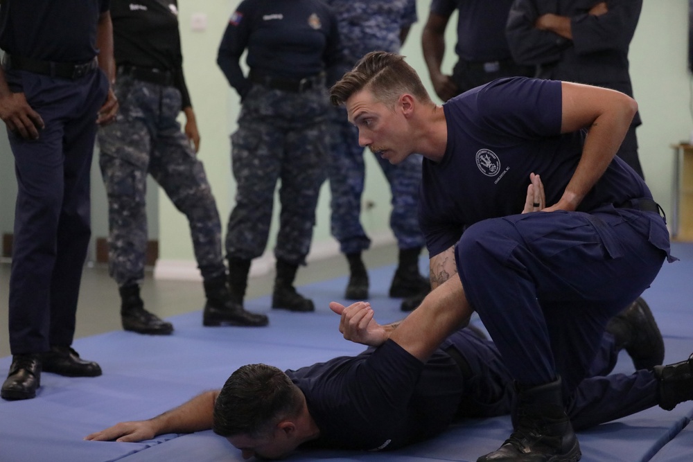 U.S. Coast Guard law enforcement instructors provides handcuffing techniques at TRADEWINDS 24