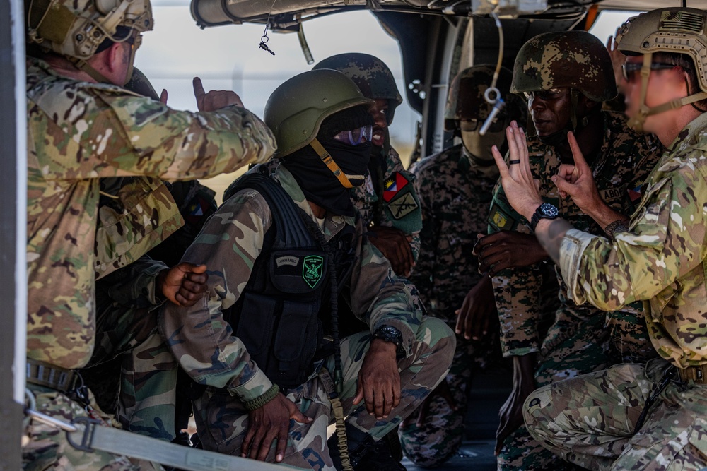 7th Special Operations Group (Airborne) Soldiers lead fast rope training for 8 partner nations