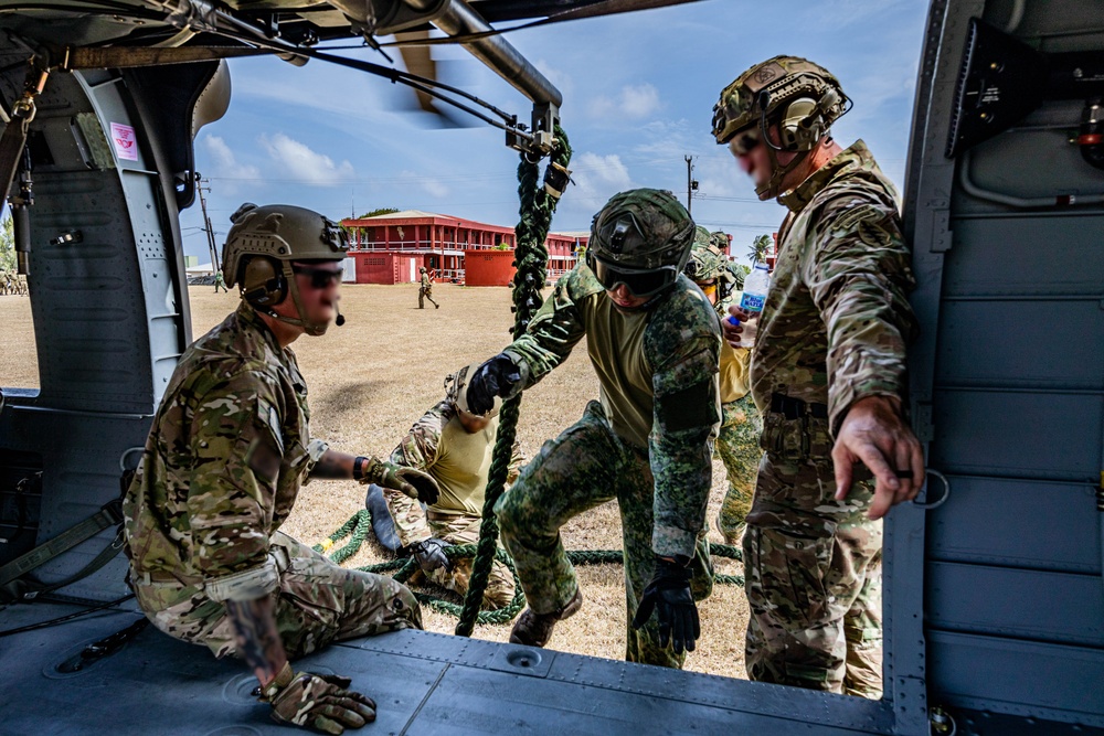 7th Special Operations Group (Airborne) Soldiers lead fast rope training for 8 partner nations