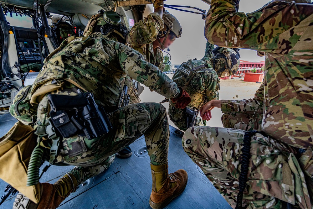 7th Special Operations Group (Airborne) Soldiers lead fast rope training for 8 partner nations