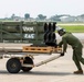 U.S. Marines with VMM-265 transport HIMARS ammunition pods with MV-22B Osprey