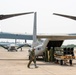 U.S. Marines with VMM-265 transport HIMARS ammunition pods with MV-22B Osprey