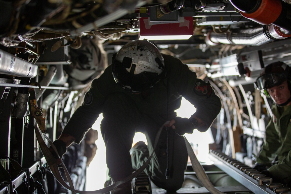 U.S. Marines with VMM-265 transport HIMARS ammunition pods with MV-22B Osprey