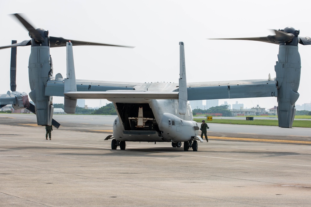 U.S. Marines with VMM-265 transport HIMARS ammunition pods with MV-22B Osprey