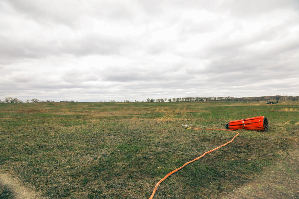 34th ECAB Conducts Helicopter Water Bucket Training with MNDNR