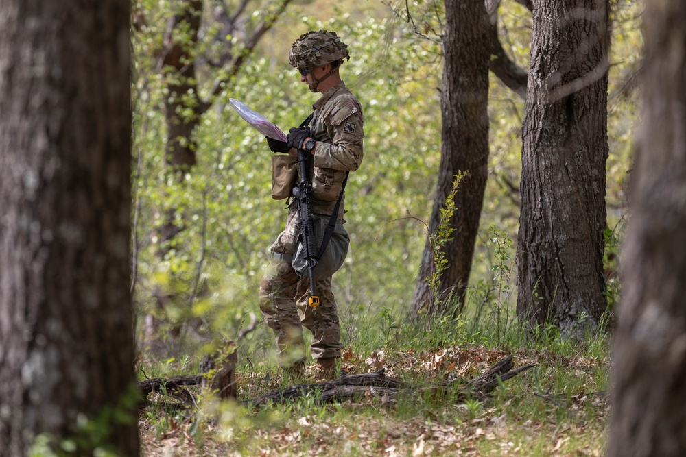 Staff Sgt. Adam Armstrong consults his map