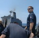 Sailors aboard the USS Howard conduct a replenishment-at-sea with the USNS John Ericsson in the South China Sea