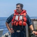 Sailors aboard the USS Howard conduct a replenishment-at-sea with the USNS John Ericsson in the South China Sea