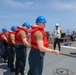 Sailors aboard the USS Howard conduct a replenishment-at-sea with the USNS John Ericsson in the South China Sea