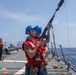 Sailors aboard the USS Howard conduct a replenishment-at-sea with the USNS John Ericsson in the South China Sea