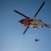 Coast Guard MH-60 Jayhawk and MH-65 Dolphin helicopter aircrews train near North Head Lighthouse in Cape Disappointment State Park, Washington