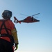 Coast Guard MH-60 Jayhawk and MH-65 Dolphin helicopter aircrews train near North Head Lighthouse in Cape Disappointment State Park, Washington