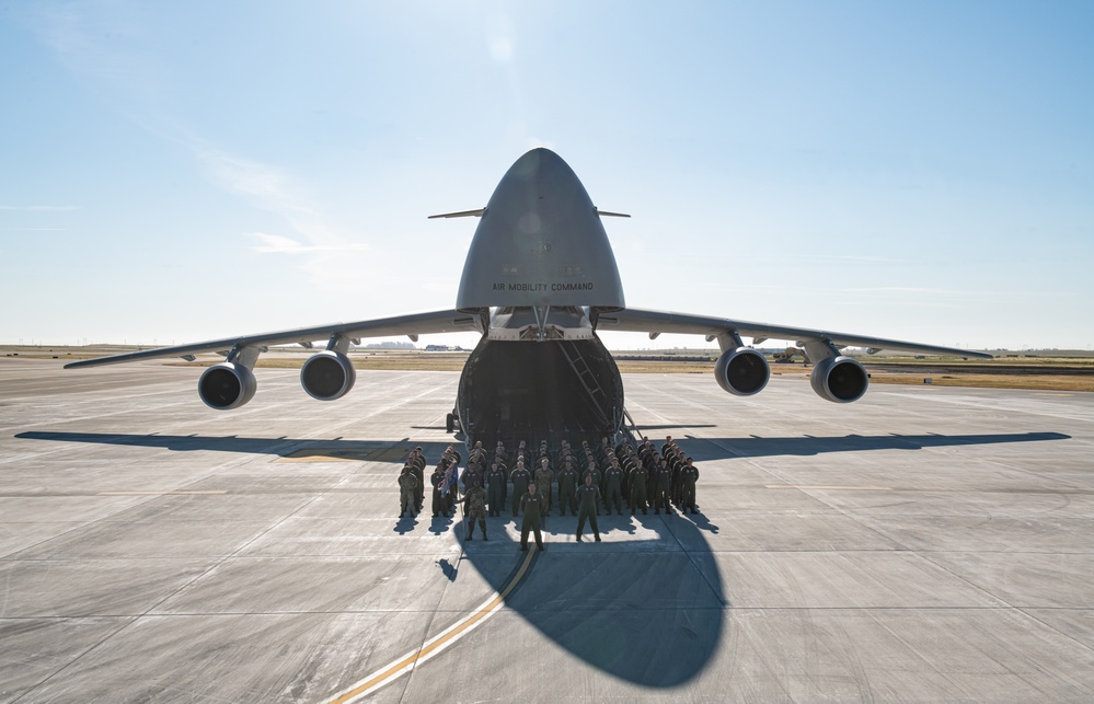 The 22nd Airlift Squadron poses fopr a group photo