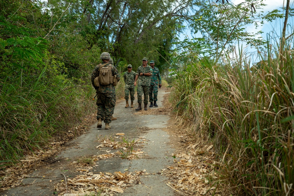 Members of the U.S. and Mexican marines, Antigua army, Suriname army, Belize army, Royal Bahamas Defence Force, and Jamaican army establish security during raid