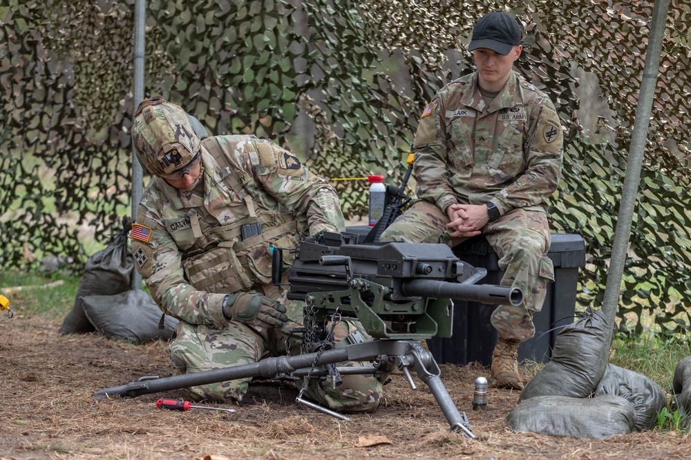 Sgt. Angelo Calvillo performs a functions check on an Mk 19