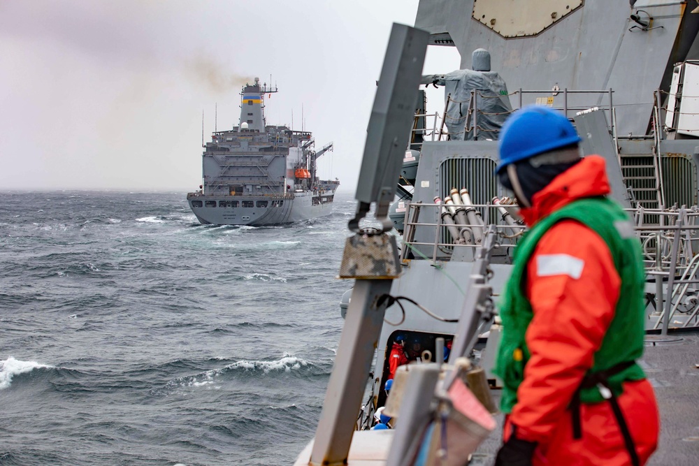 USS Ralph Johnson conducts replenishment at sea.