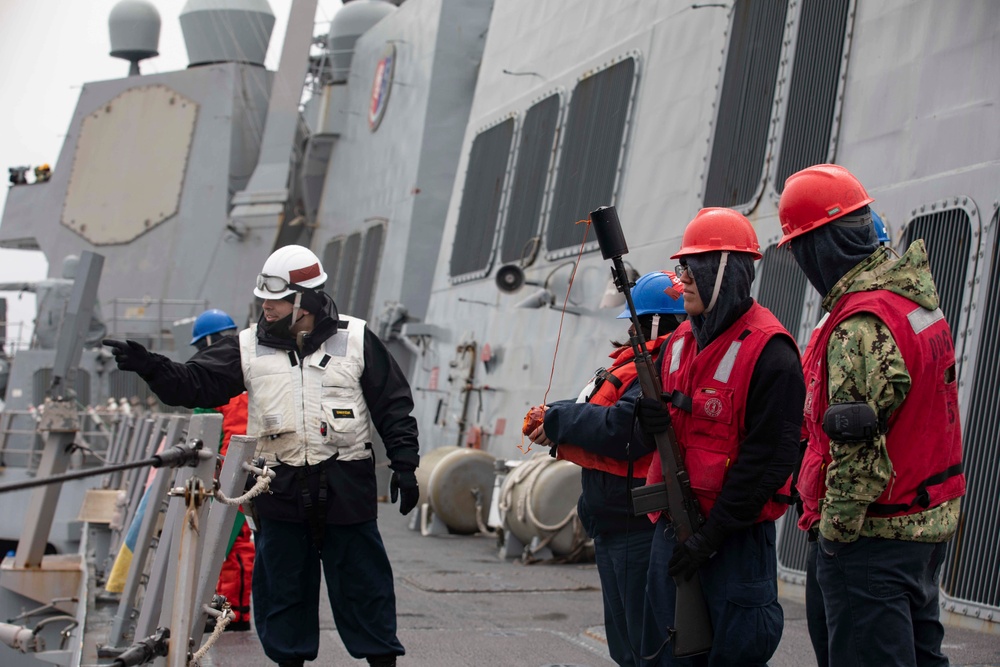 USS Ralph Johnson conducts replenishment at sea.