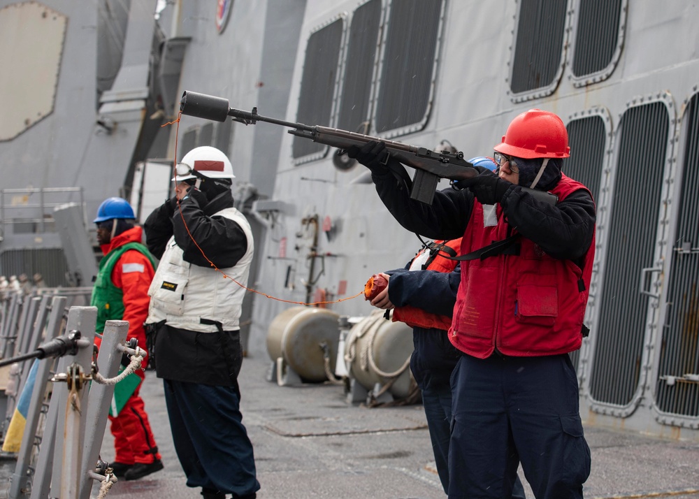 USS Ralph Johnson conducts replenishment at sea.