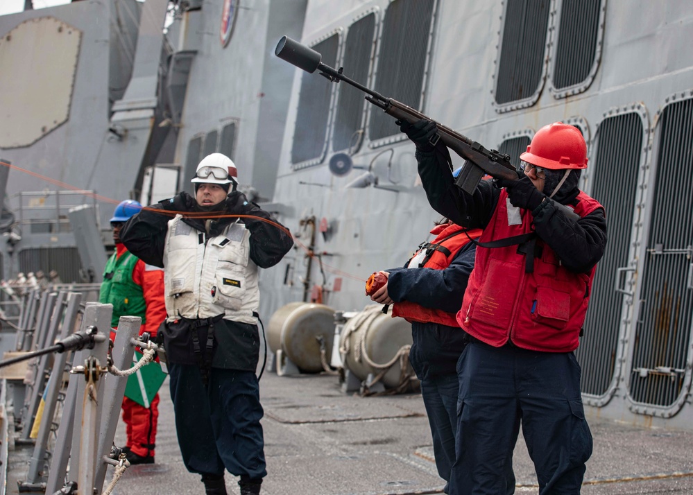 USS Ralph Johnson conducts replenishment at sea.