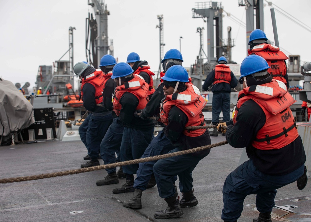 USS Ralph Johnson conducts replenishment at sea.