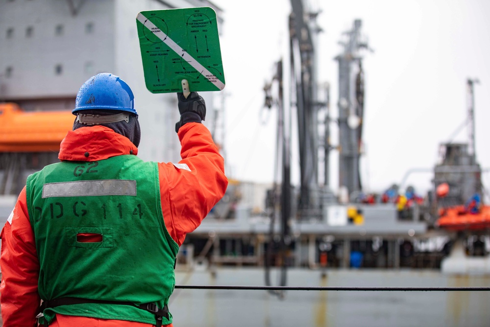 USS Ralph Johnson conducts replenishment at sea.